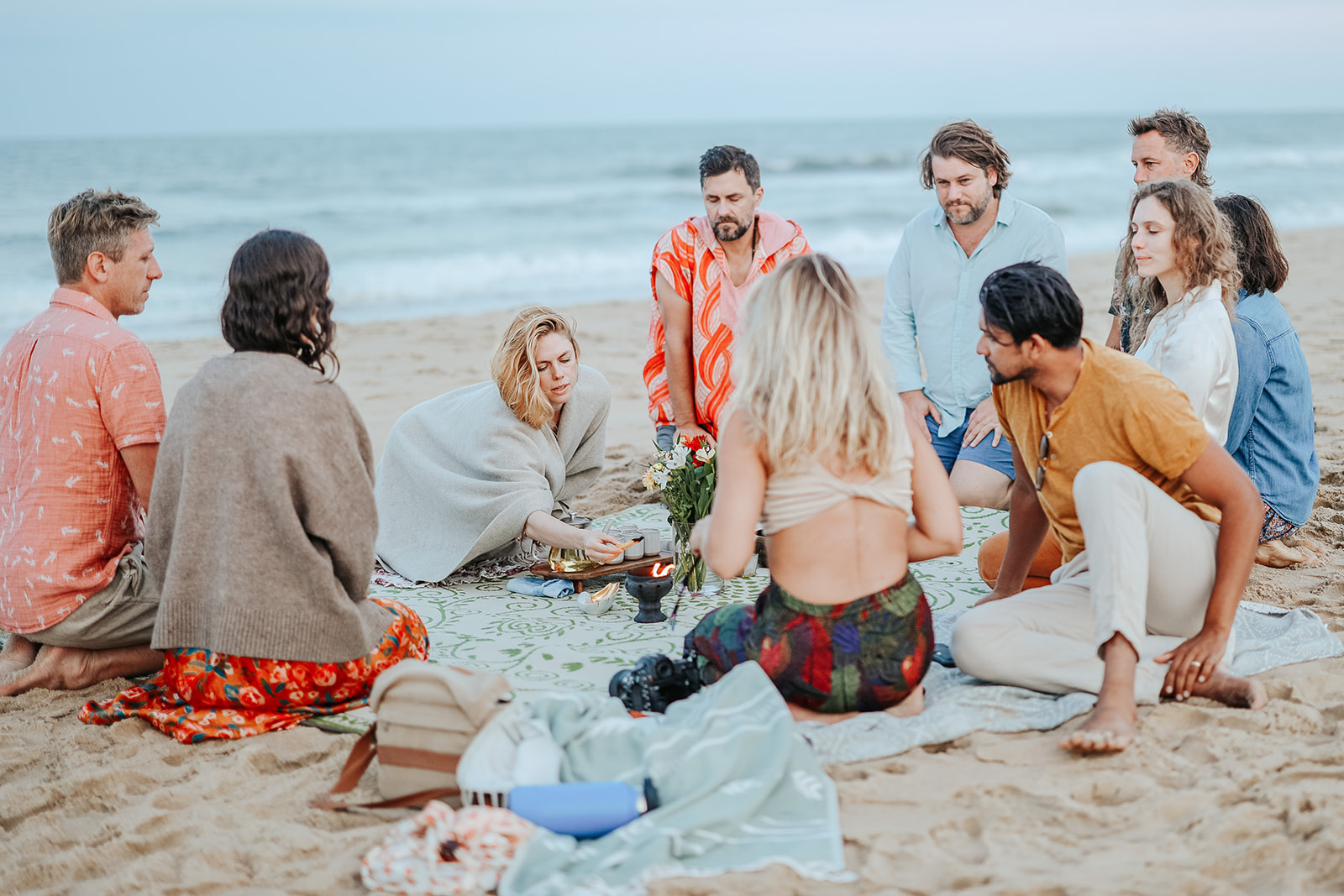 Tea ceremony circle on the beach at sunset