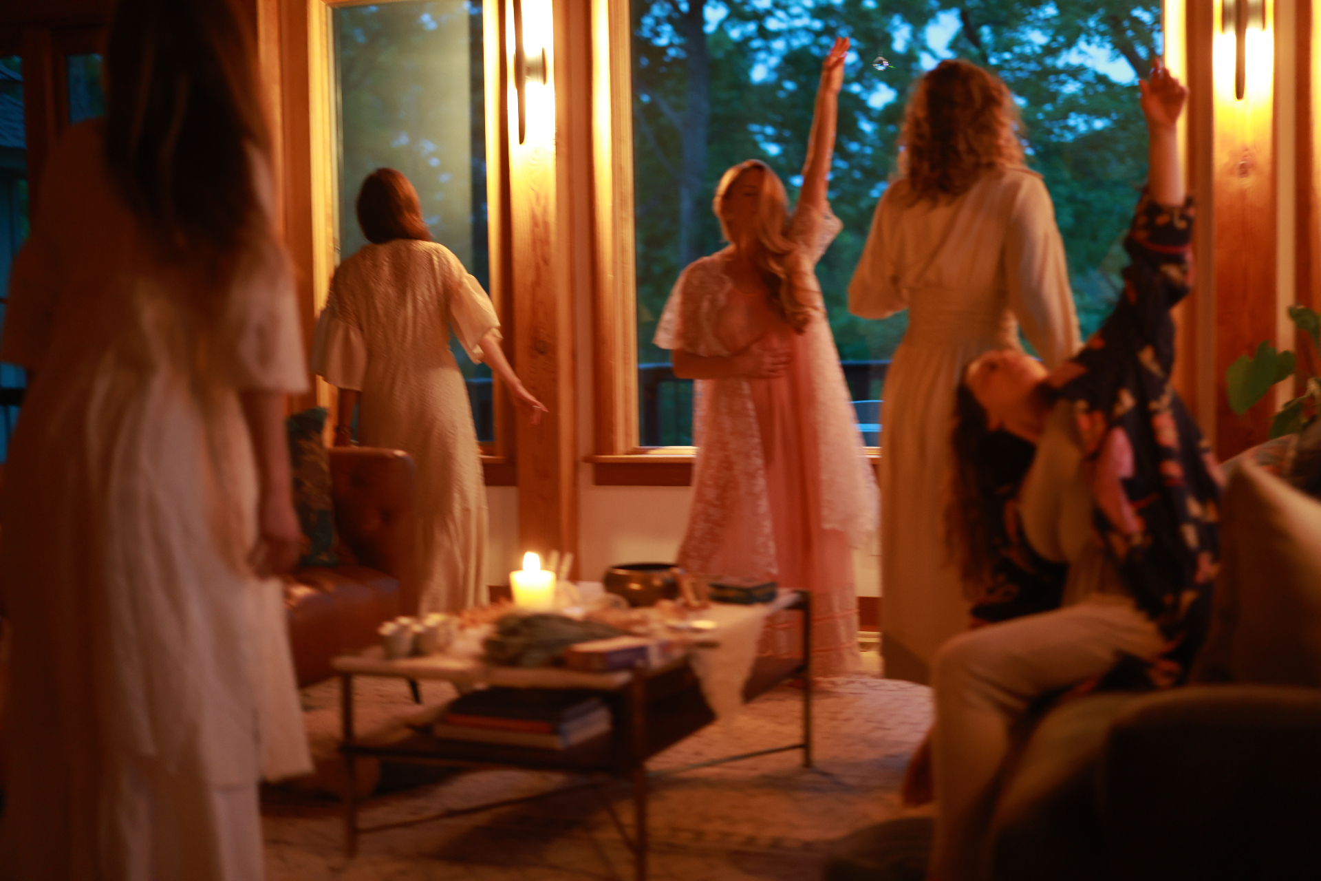 Ecstatic dance in candlelit gathering